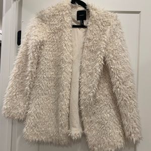 White faux fur coat